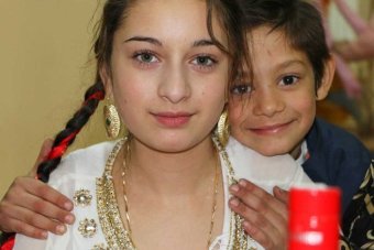 Portrait of Perty Close up of young teenager alongside a young boy