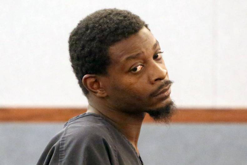Paul Darell Jones, charged with murder in the death of his 13-year-old son Aaron Jones, appears ...
