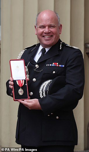 Sir Craig Mackey, pictured receiving Investiture, a former deputy commissioner of the Metropolitan Police, has been asked by the Government to lead a detailed review of the NCA, what new powers it needs and what laws need to change to make it more effective.