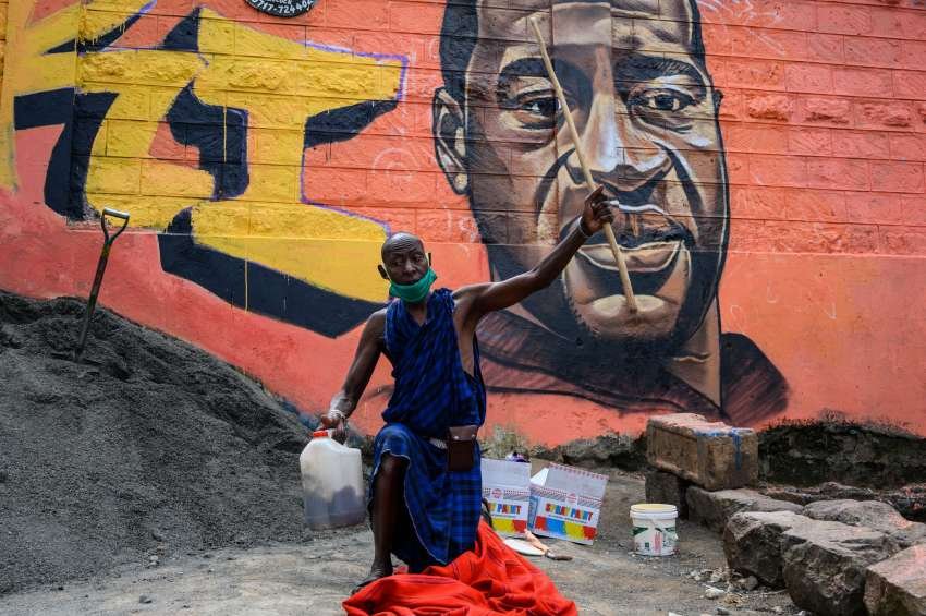 Kenyan mural artist Allan Mwangi, also known as Mr.detail.seven, painted a graffiti mural in the Kibera slum in Nairobi on June 3.