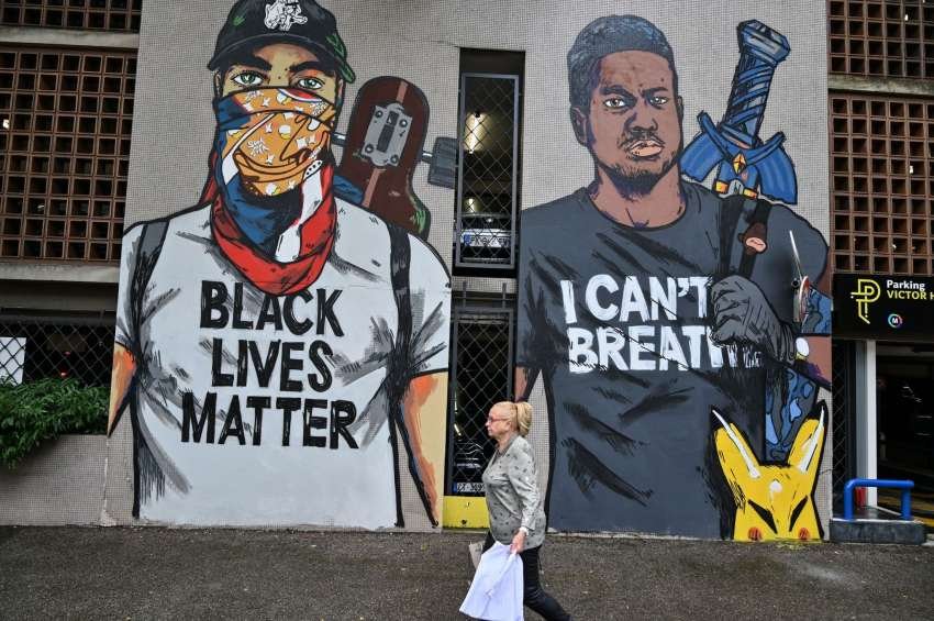 This mural painted by French artist Combo in homage to George Floyd.