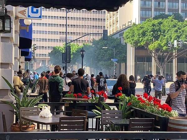 Police fire tear gas into a crowd of demonstrators in dow...