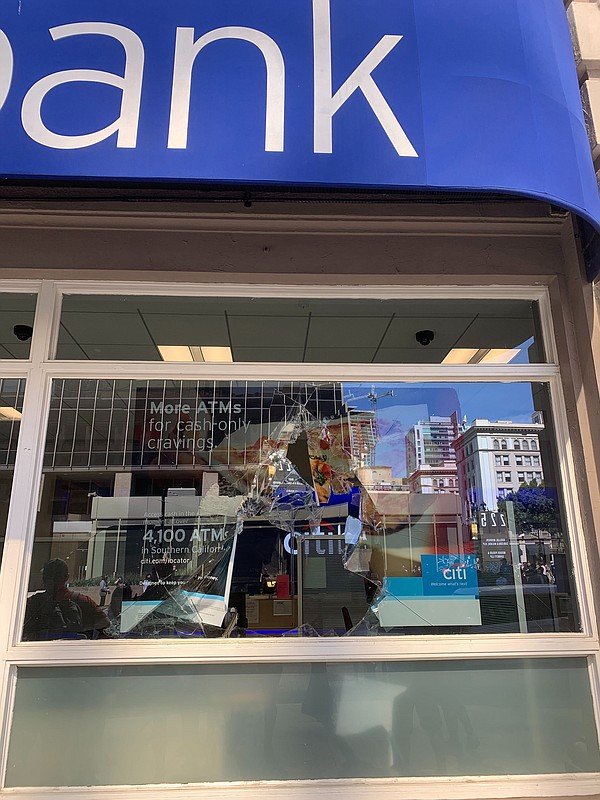 A broken window is pictured at a Citi Bank branch in down...