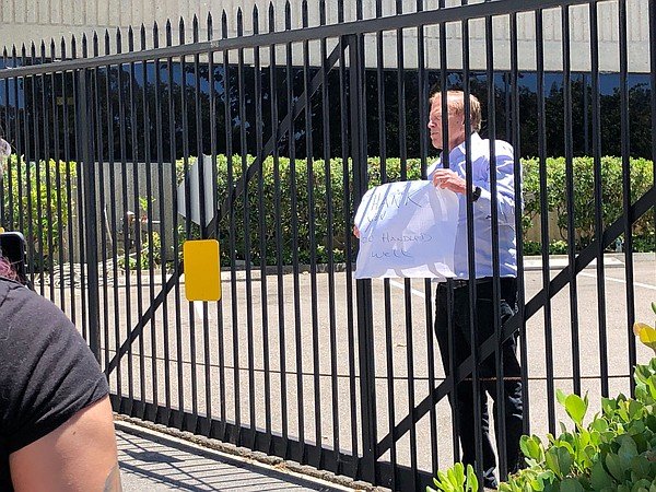 One American News Network (OANN) CEO Robert Herring holds...