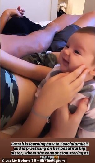 Adorable: Ben's wife Jackie also shared a video, which showed Aiofe doting on her little sister, adding the caption, 'Farrah is learning how to "social smile"