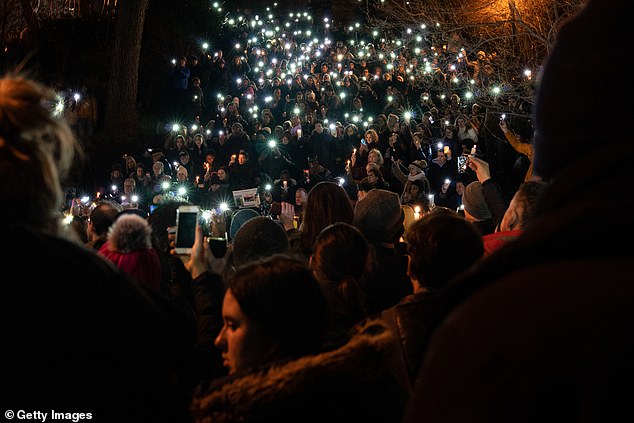 Hundreds attend a candlelight vigil held for a murdered Barnard College student Tessa Majors on Sunday in the park where she was stabbed