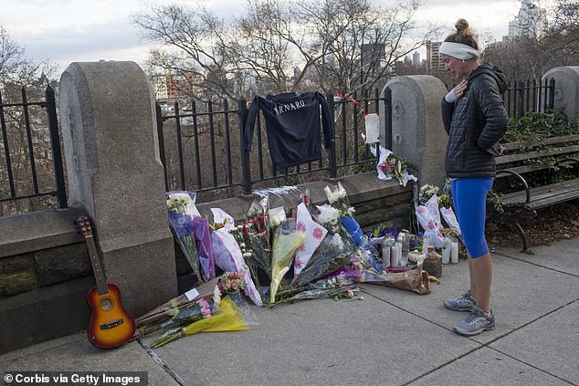 Flowers are left at the entrance of Morningside Park in memory of Tessa Majors