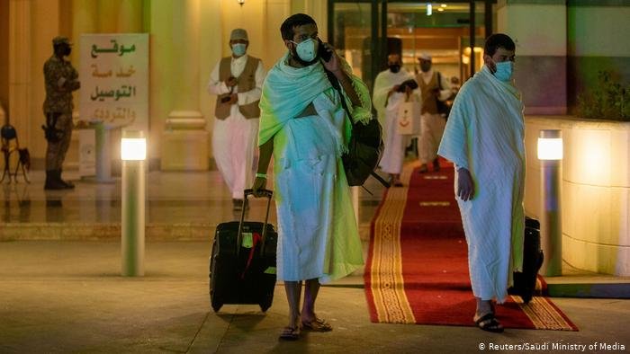 Muslim pilgrims wear protective masks heading to the Meeqaat Muslim pilgrims wear protective masks heading to the Meeqaat