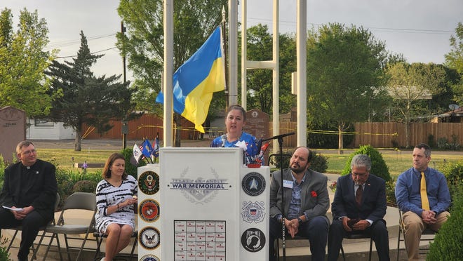 Glenda Moore of Kind House Ukraine Bakery speaks about her nonprofit's mission in May during a prayer vigil for the people of Ukraine.