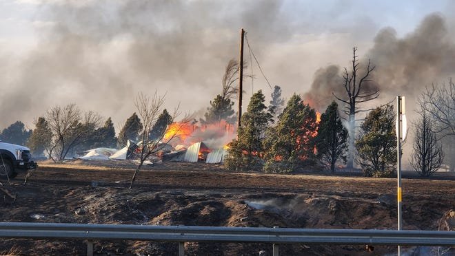 Emergency crews responded to a windswept fire that destroyed four homes in February near the Cadillac Ranch and I-40.