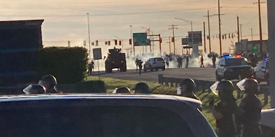 photo of police firing tear gas in Hobart, Indian
