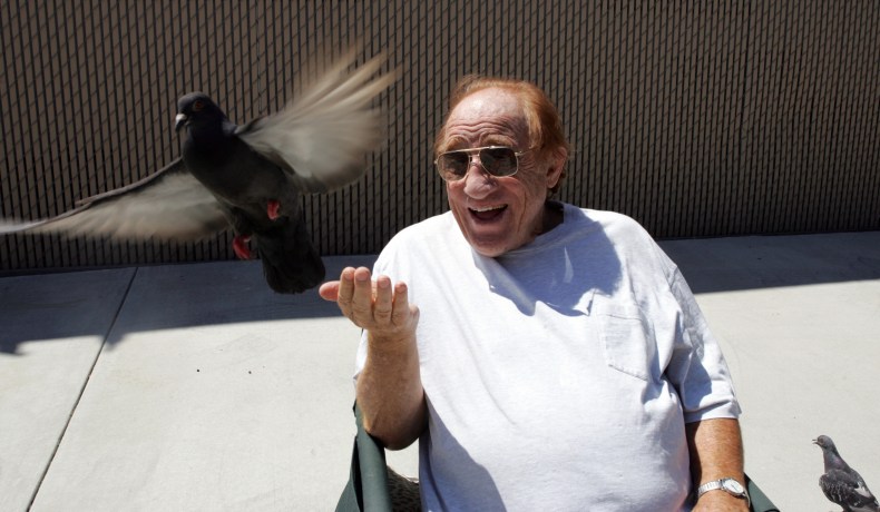 Martial Arts Legend Gene LeBell spends some time feeding his...