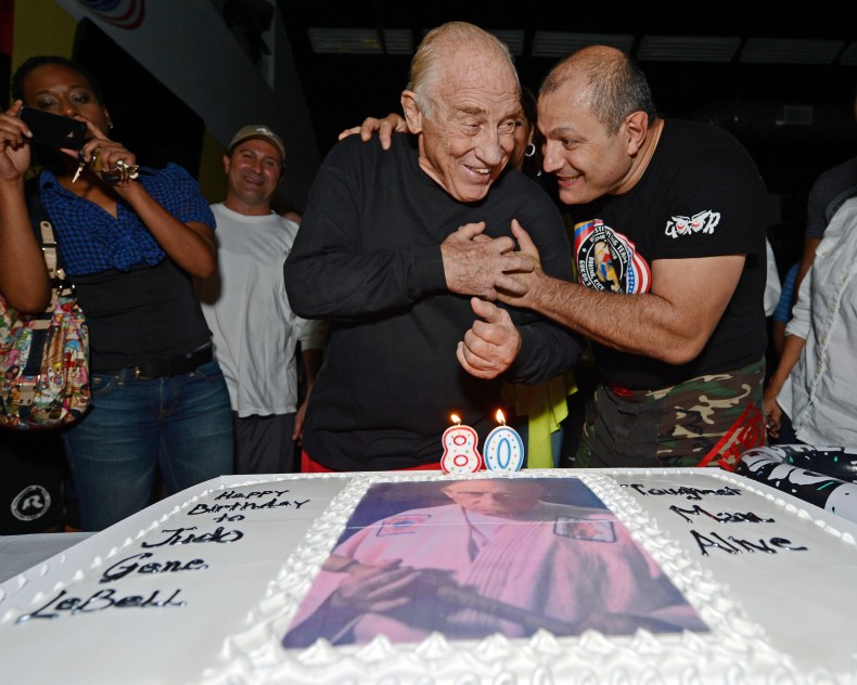 ‘Judo” Gene LeBell smiles as Gokor Chivichyan gives him a...
