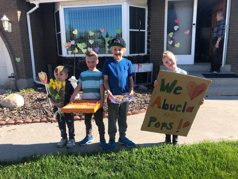 (Photo courtesy of Caisa Brown) The Brown boys, from left Taggart, 5; Crew, 8; Beckley, 10; and McKay, 8; stand in front of their grandparents' house in April 2020. Unable to have close contact with their grandparents because of COVID-19, they gave them a 