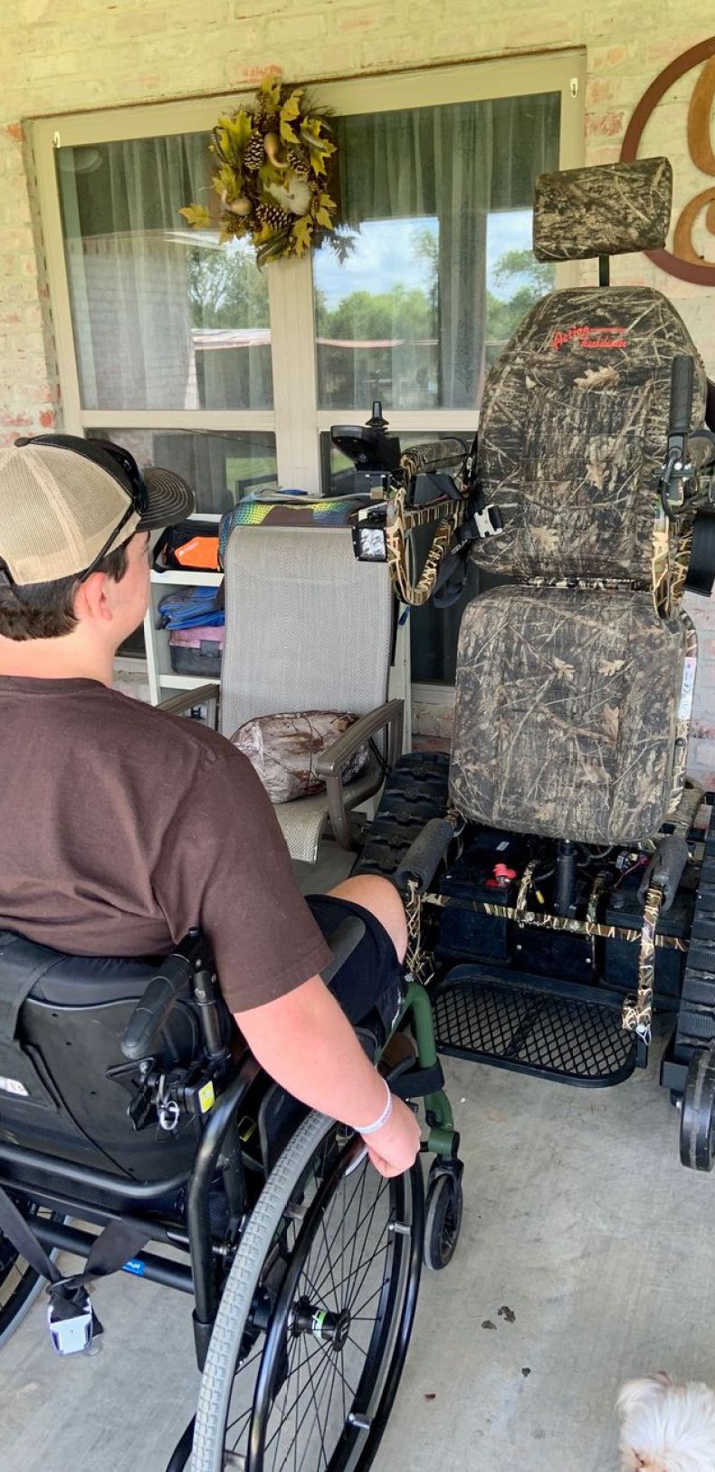 Drake has a special track chair that allows him to stand up outdoors.