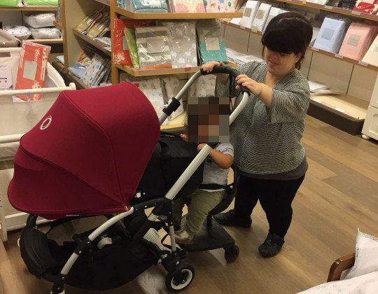 Cathy Reay with her first child and a pram