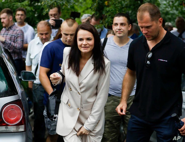  Sviatlana Tsikhanouskaya, candidate for the presidential elections, center, after voting at a polling station in Minsk, Belarus, Aug. 9, 2020.   