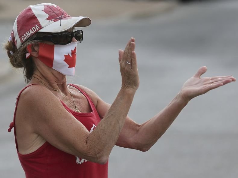 WINDSOR, ON. JULY 30, 2020 - A group of approximately 50 people participated in a demonstration on Thursday, July 30, 2020 in downtown Windsor, ON. to highlight the plight of victims of human trafficking. The event was organized by the Operation Underground Railroad organization and included speeches and a short march. Lisa Doig claps during the event. (DAN JANISSE - The Windsor Star)