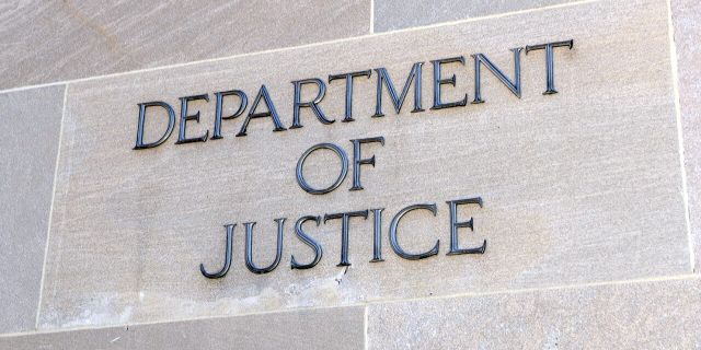 Department of Justice sign, Washington, D.C. Many law enforcement agencies are administered by the DOJ, including the FBI, DEA and Federal Bureau of Prisons