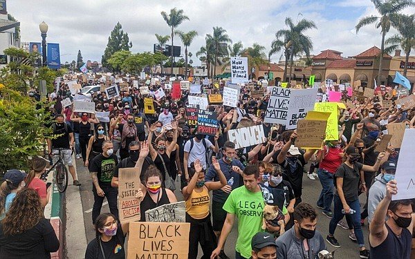Protesters march in Hillcrest on the ninth-straight day o...