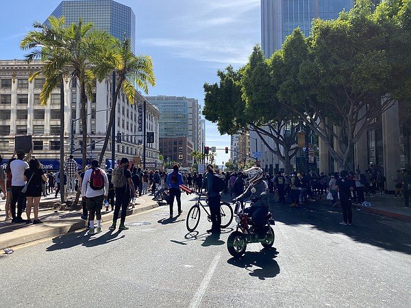 Police fire tear gas at protesters in downtown San Diego,...