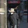 A pedestrian wears a mask as they walk through a quiet downtown in Toronto on Wednesday, April 7, 2021. Two government sources say Ontario's top doctor will recommend the public begin masking on Monday in an effort to help overwhelmed children's hospitals.THE CANADIAN PRESS/Tijana Martin