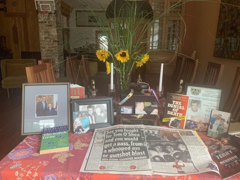Tom O’Shea’s family created a dining room shrine so relatives can feel like they are still having dinner with him.